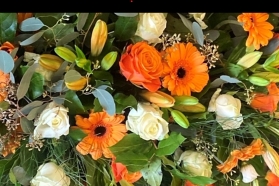 Vibrant Oranges Casket Spray