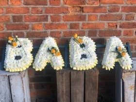 Baba Tribute with corsage sprays