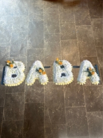 Baba Tribute with corsage sprays