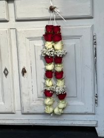 Red Naomi Rose and white avalanche rose garland with gypsophila baby's breath