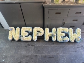 Nephew tribute with corsage spray