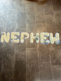 Nephew tribute with corsage spray