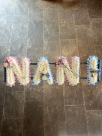 Classic Tribute with pink and blue ribbon