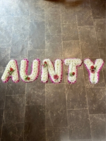 Aunty tribute with corsage and sprays