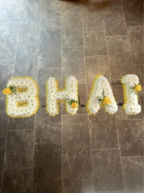 Bhai tribute with corsage sprays