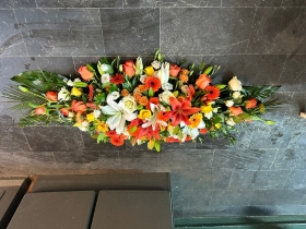 Colourful Oranges Casket Spray