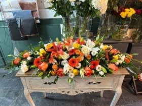 Colourful Oranges Casket Spray