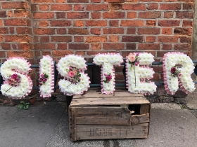 Sister tribute with corsage sprays